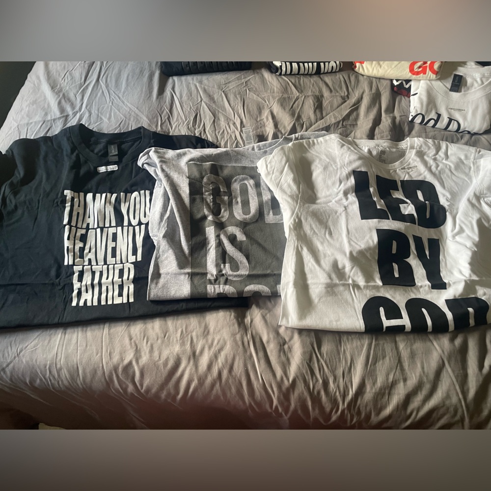 Three unisex Graphic T-Shirts - Black, Gray, and White. Size large